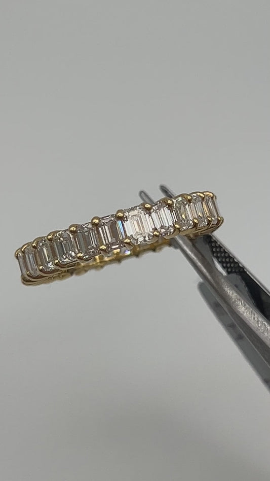 Emerald cut natural diamond eternity band in 14k yellow gold